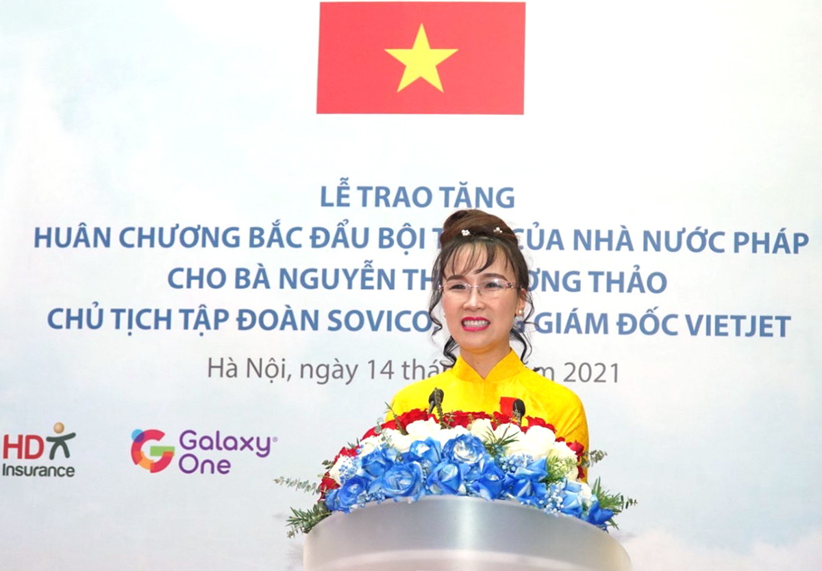A person standing in front of a signDescription automatically generated