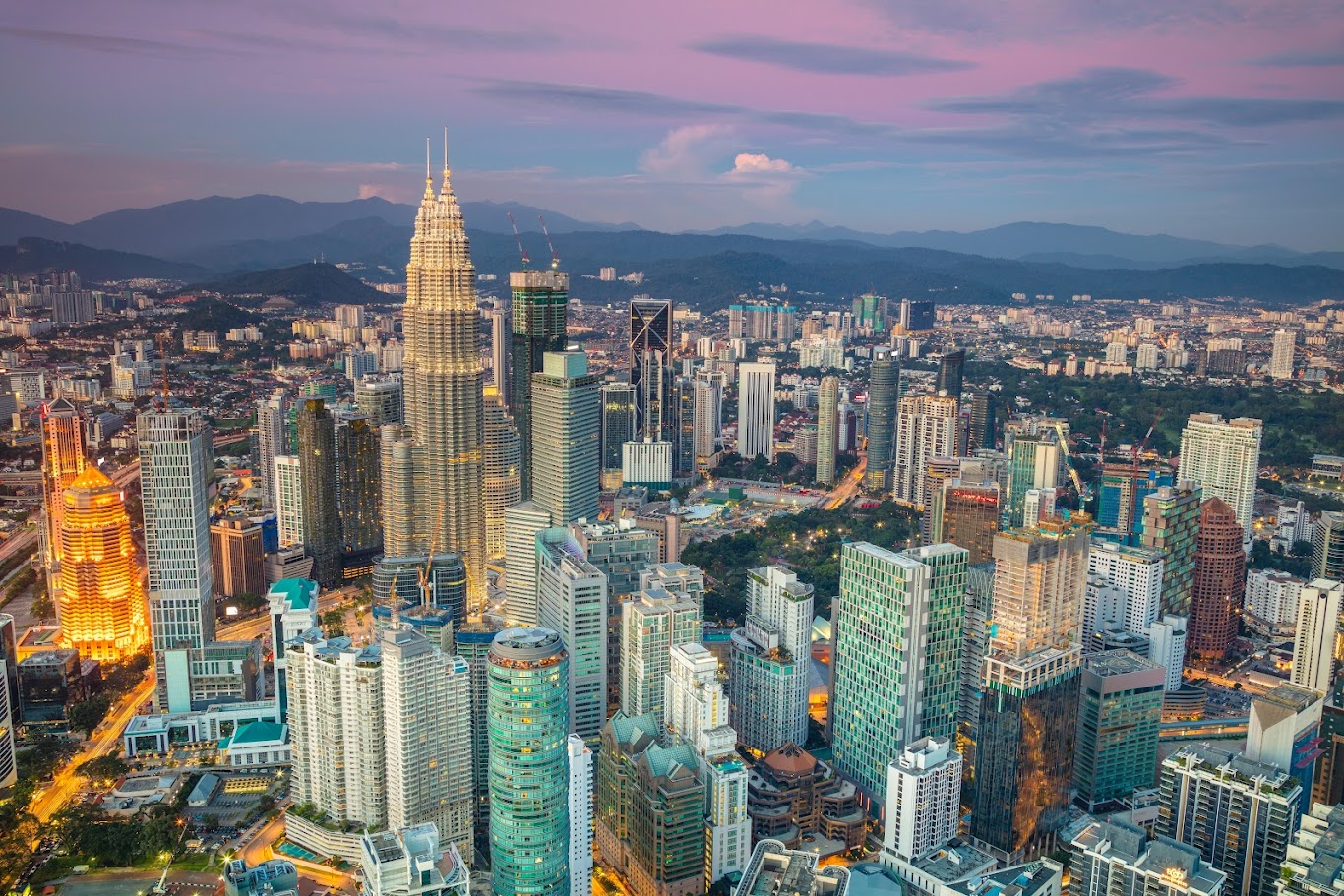 Should you choose a hotel in downtown Kuala Lumpur or near the airport?