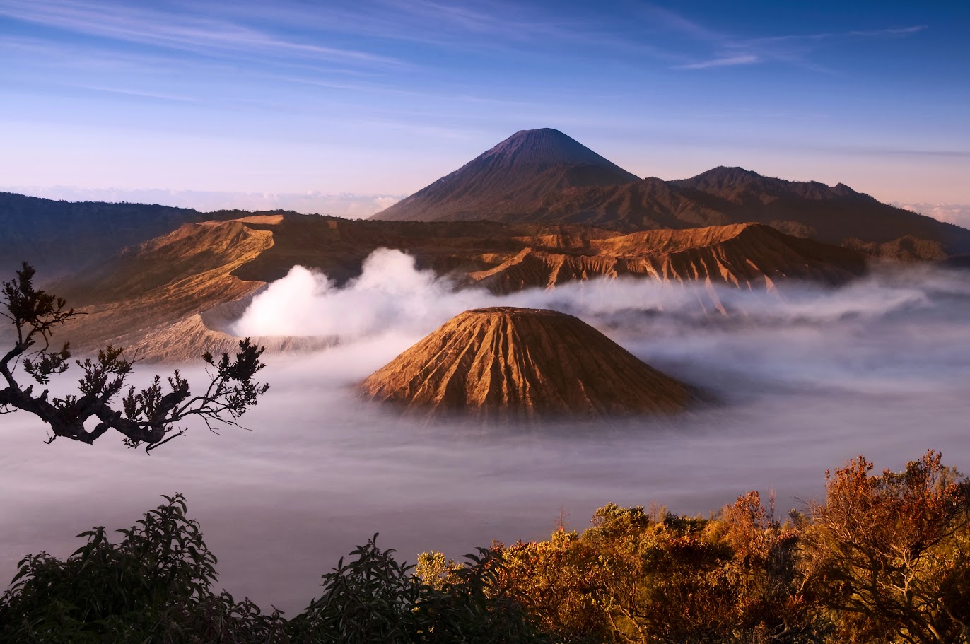The majestic Bromo Crater releasing white smoke on Java Island, Indonesia.