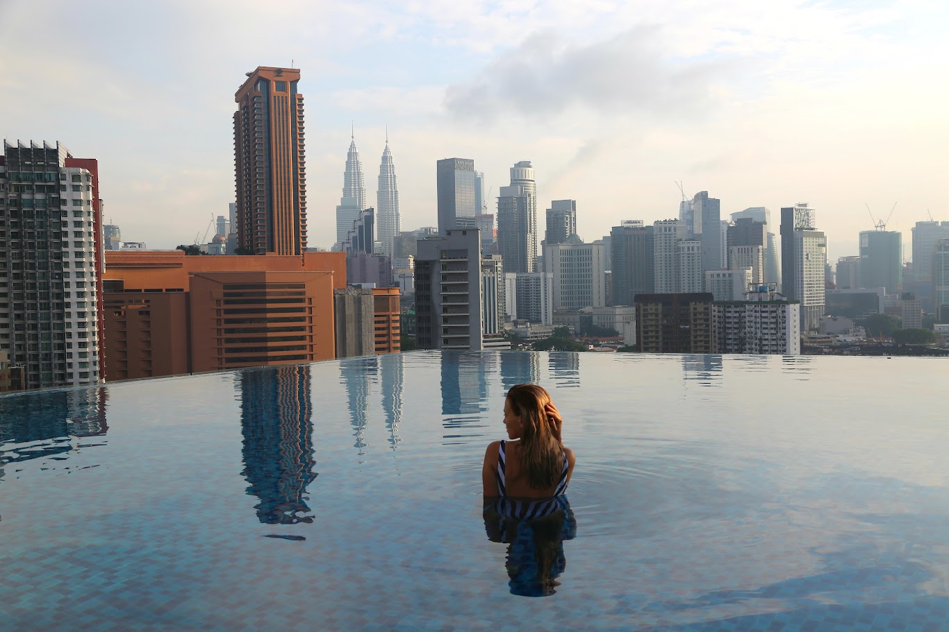 Should you choose a hotel in downtown Kuala Lumpur or near the airport?