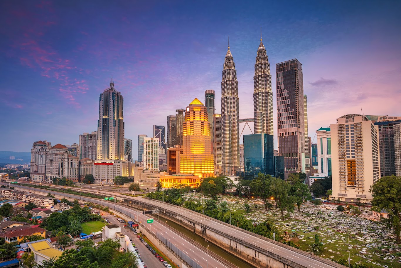 Should you choose a hotel in downtown Kuala Lumpur or near the airport?