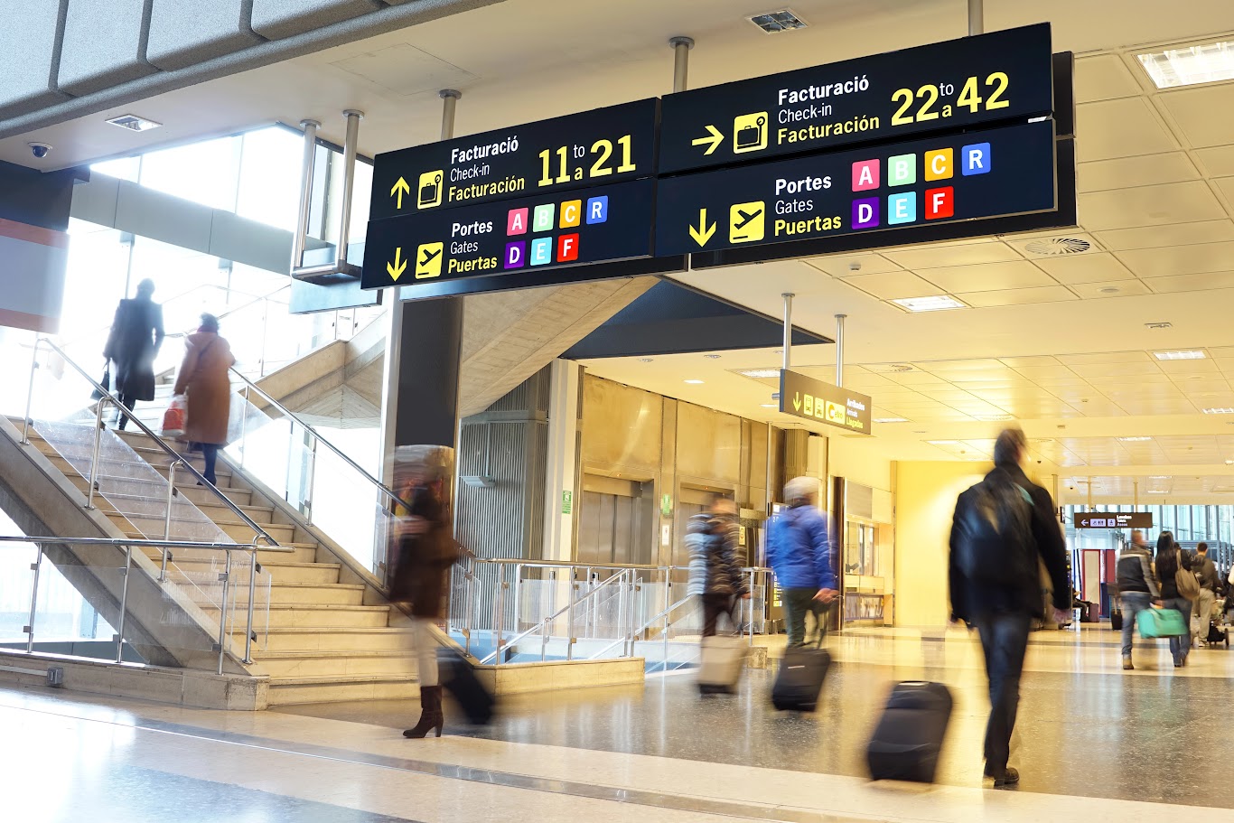 Passengers moving to different areas inside the airport