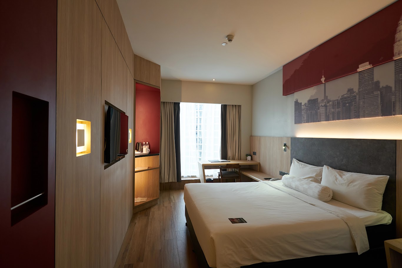 Should you choose a hotel in downtown Kuala Lumpur or near the airport?